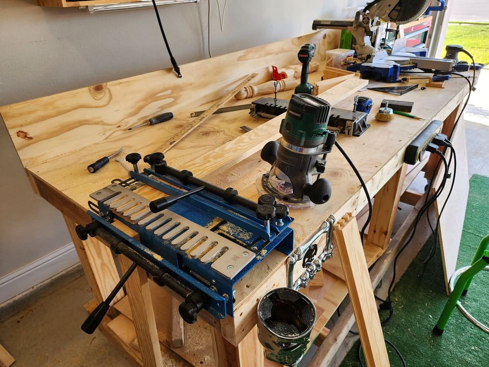 Router table and hand tools on the workbench