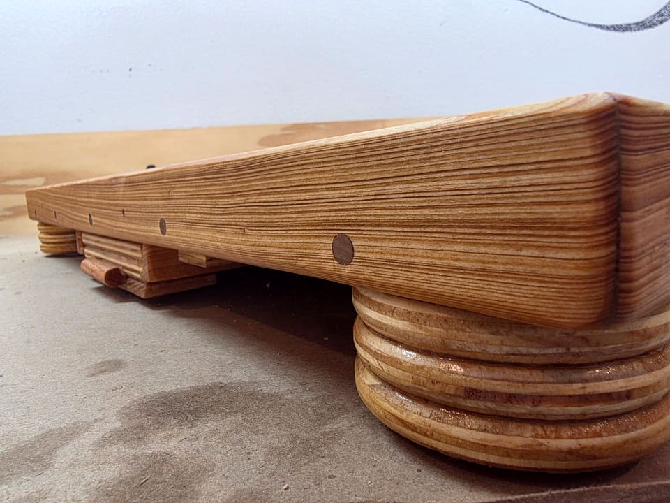 Edge detail of the layered marble board showing the stacked hardwood