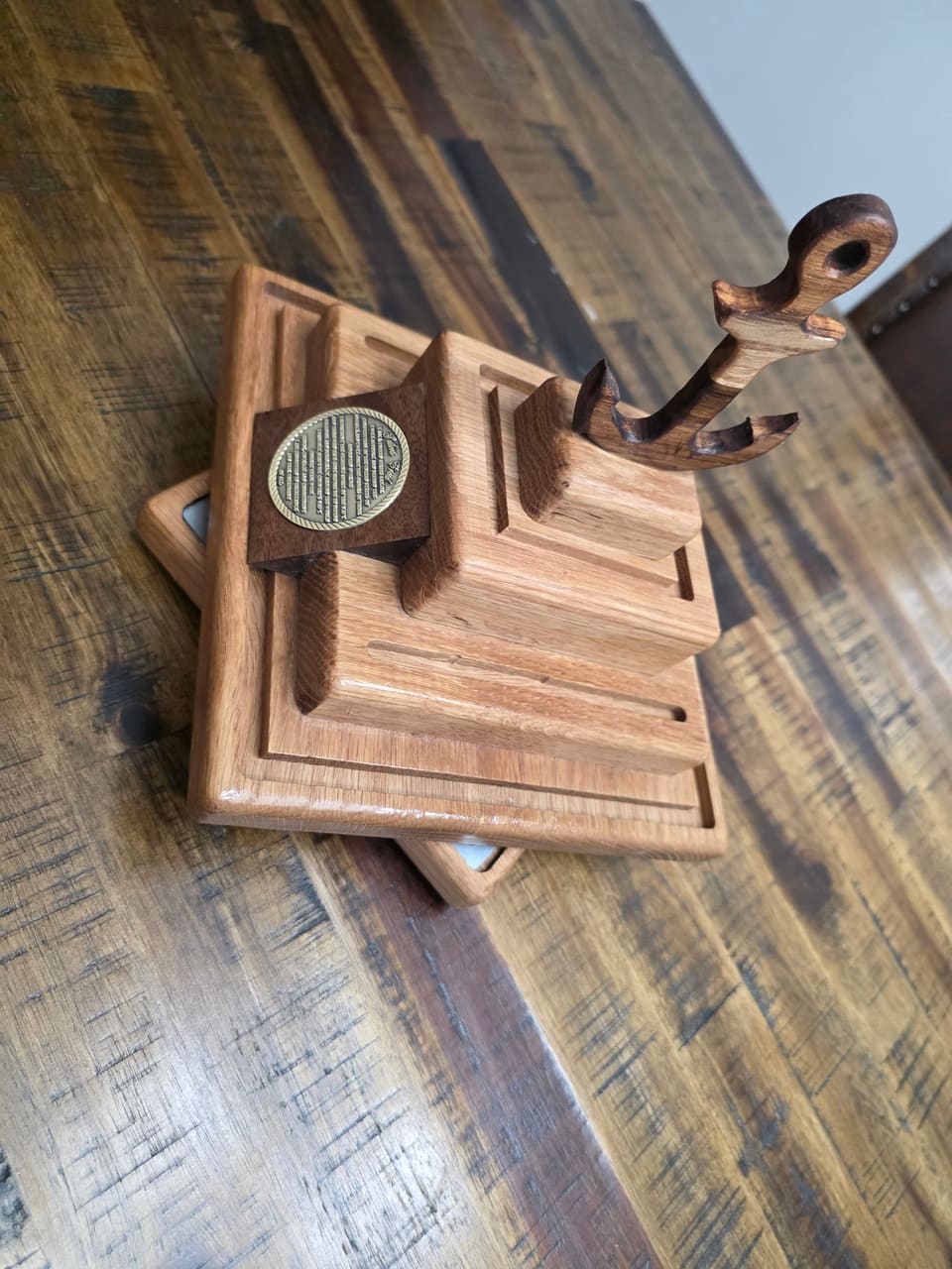 Stepped oak valet with routed grooves and a turned post, top view