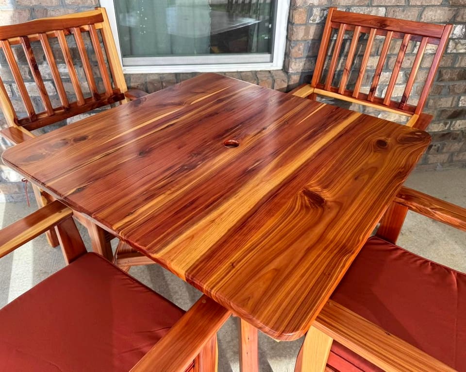 Close view of the plank tabletop in red-toned wood