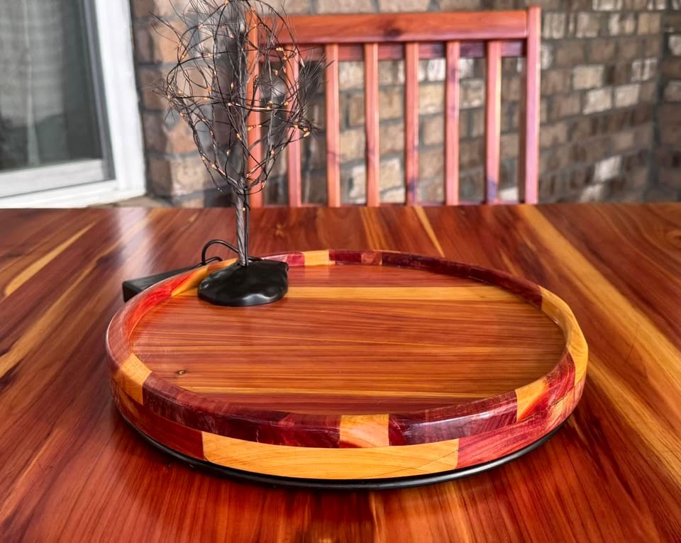 Close view of the round wood tray with a banded edge
